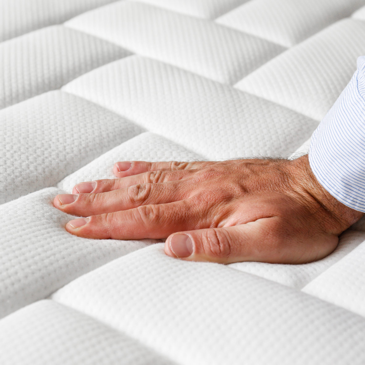 hand on mattress